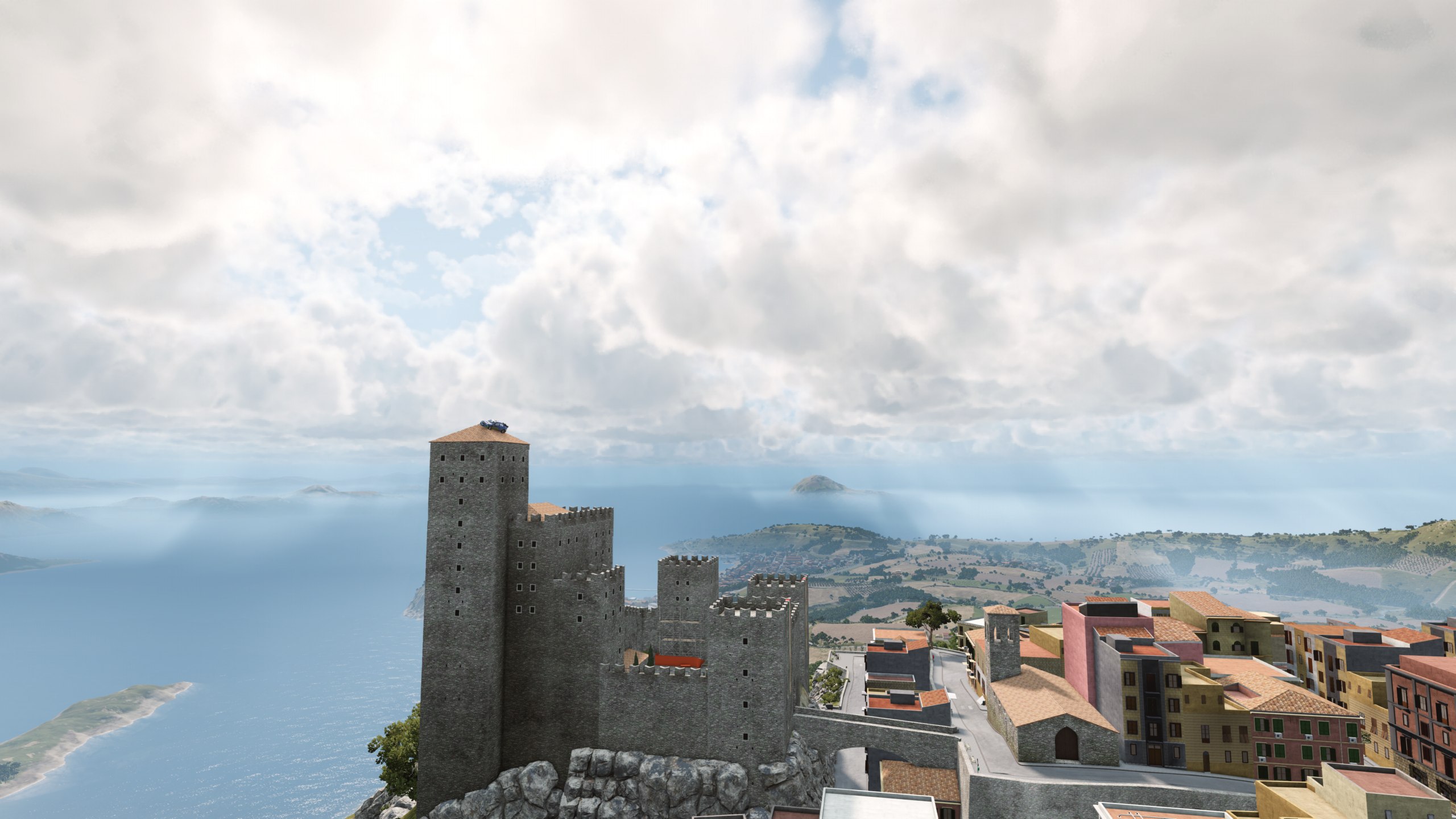 BeamNG.Sky volumetric cloud layers above a coastal BeamNG.drive landscape